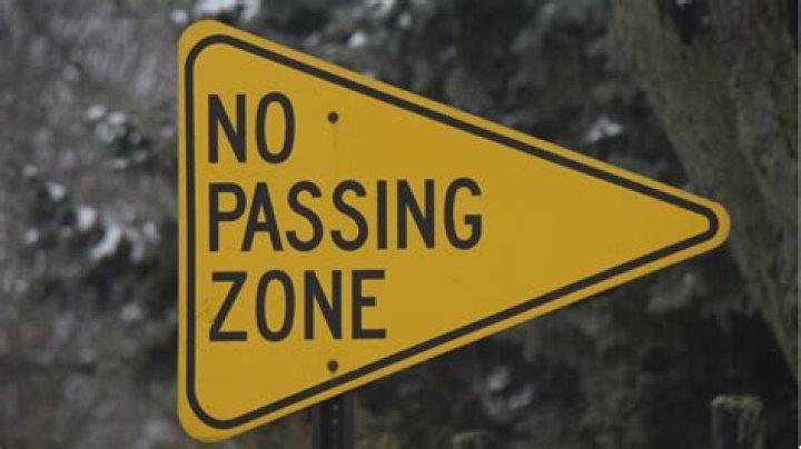What does no passing zone sign mean